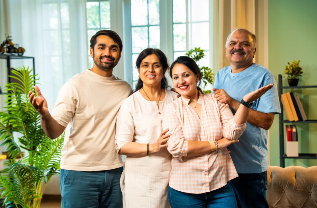 Happy Indian family reunited in an Australian home after successful family visa approval.